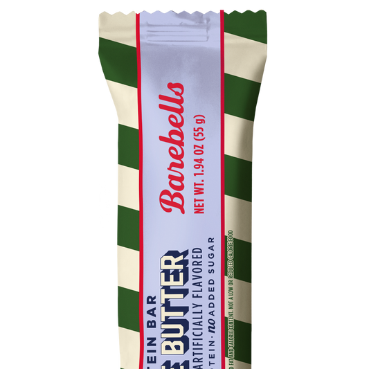 Barebells Cookie Butter protein bar in green and cream striped wrapper with lavender label