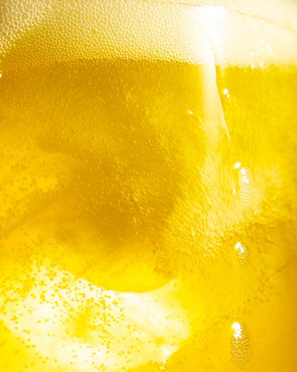 Barebells Protein Soda Pineapple Sunrise Hover Background