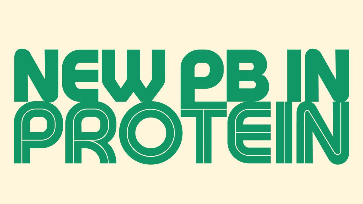 “NEW PB IN PROTEIN” in large, bold green retro lettering filling a cream background. “NEW PB IN” is solid, while “PROTEIN” is styled with a thin inner outline.