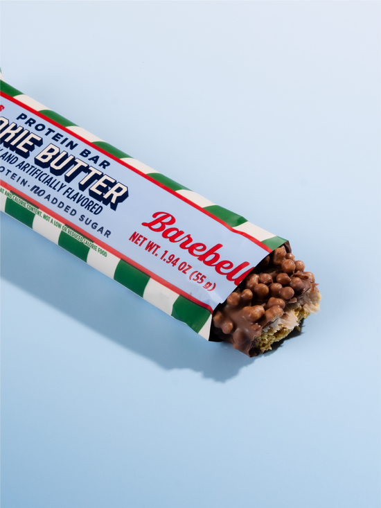 Barebells Cookie Butter protein bar with chocolate coating and crispy pearls, wrapped in green, white and red striped packaging