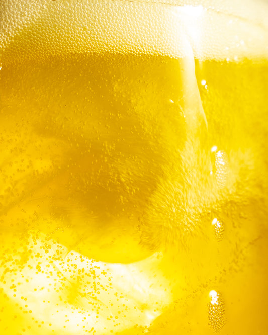 Barebells Protein Soda Pineapple Sunrise Hover Background